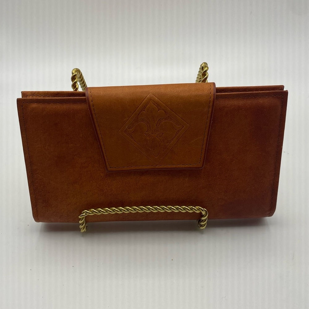 Amity cowhide leather oxblood wallet clutch.